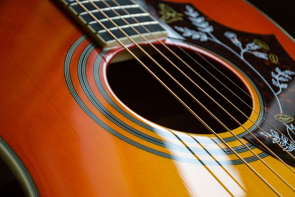 Acoustic guitar soundhole and top close-up