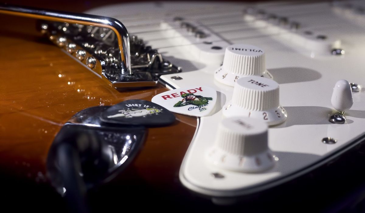 Electric guitar pickguard, knobs, and tremolo arm