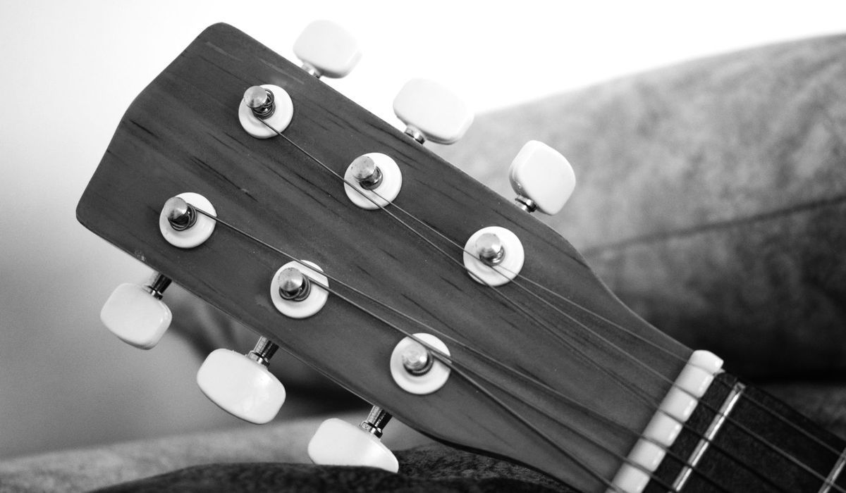 Acoustic guitar headstock and tuners in black and white