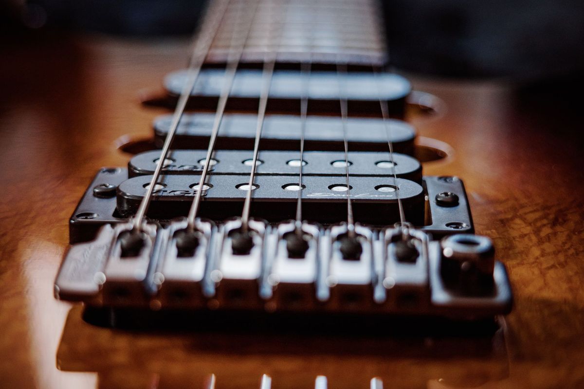 Humbucker pickup and bridge on an electric guitar