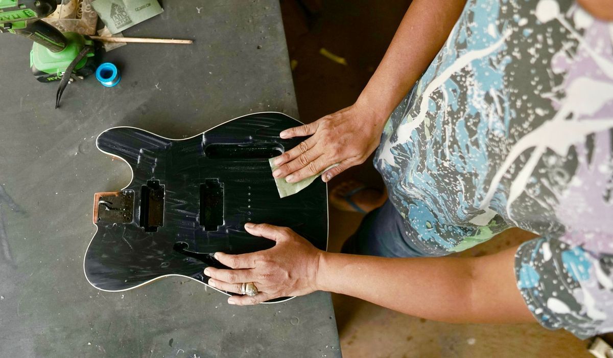 Guitar body being sanded on a workbench